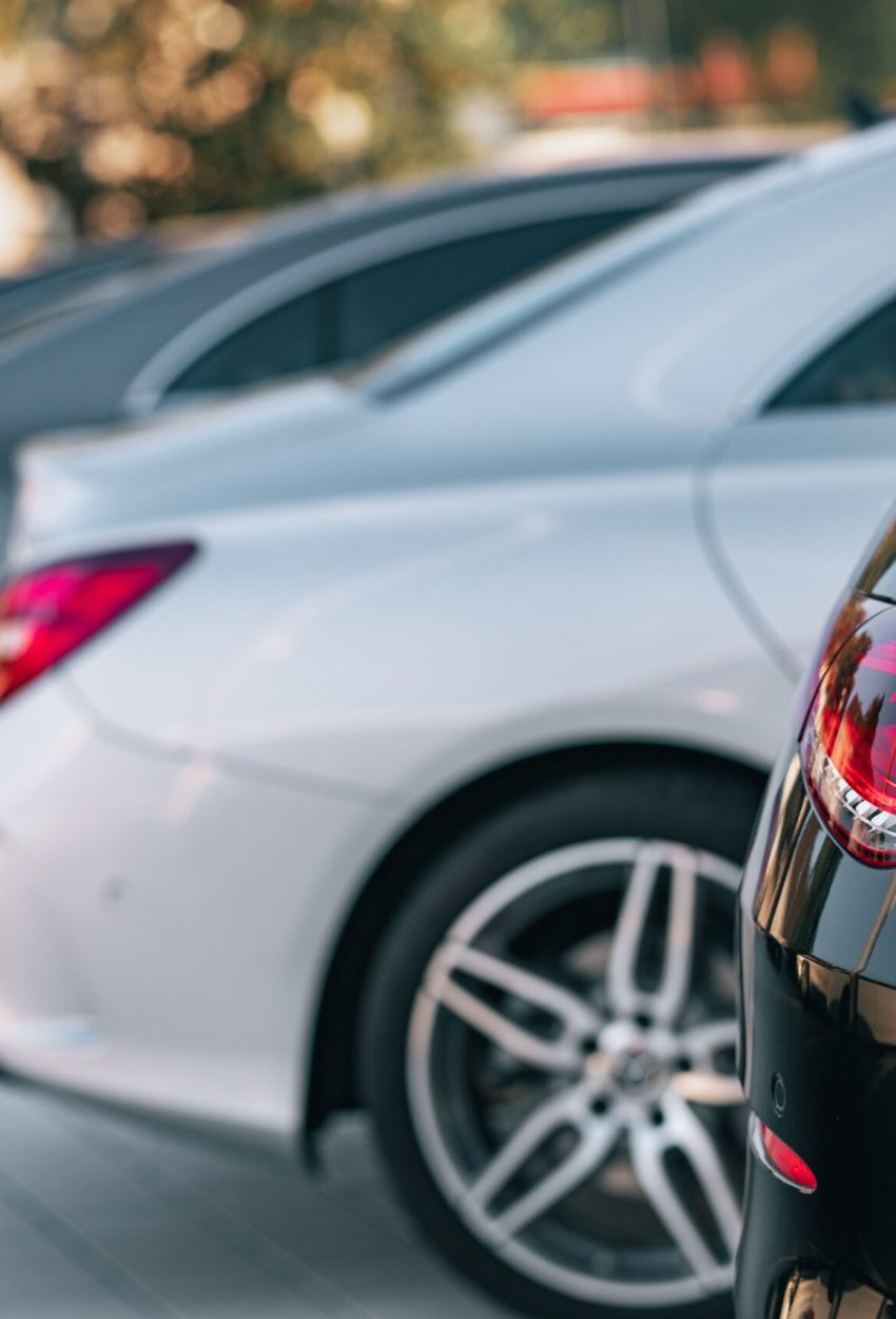 Selective focus view of different Mercedes-Benz cars parked in a row A selective focus view of different Mercedes-Benz cars parked in a row